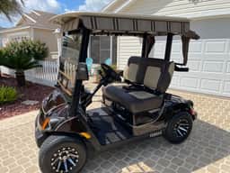Modern charm meets vibrant living with outdoor oasis and golf cart fun!