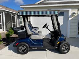 Stylish home with gourmet kitchen, dual garages, and private golf cart!