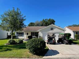 Cozy home w/golf cart, lanai, smart TVs, & prime location near town squares!
