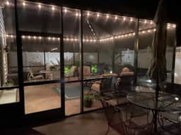 Sunlit open-concept retreat w/granite kitchen island, golf cart & dual lanai.