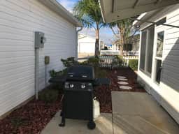 This home has it all! Golf Cart, BBQ Grill & Close to Recreation!!