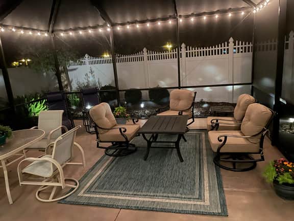 Sunlit open-concept retreat w/granite kitchen island, golf cart & dual lanai.