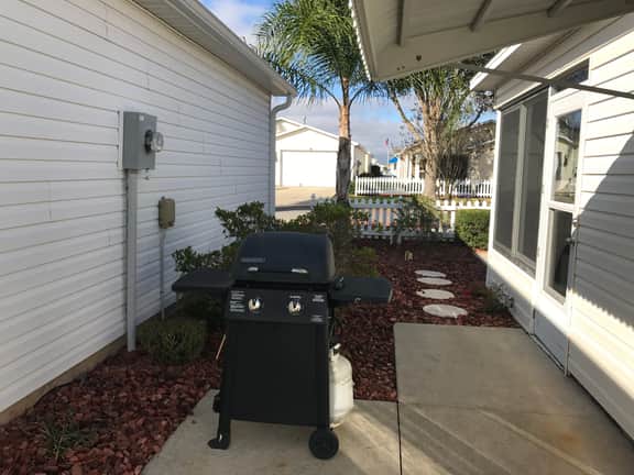 This home has it all! Golf Cart, BBQ Grill & Close to Recreation!!
