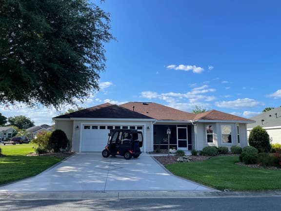 Modern elegance meets Florida charm in this stunning home with golf cart!