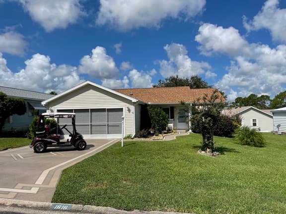 Sunlit retreat overlooking championship fairways—your Florida oasis awaits!